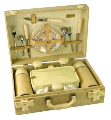 A Brexton picnic hamper, cream case, 14cm high, 42cm wide, 14cm deep.