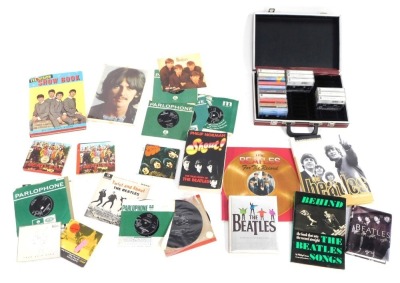 A group of Beatles ephemera, to include television show book, Beatles Fab Four books, Sgt. Pepper and Rubber Soul CD's, Twist and Shout 33's etc. (1 box)