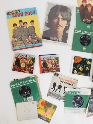 A group of Beatles ephemera, to include television show book, Beatles Fab Four books, Sgt. Pepper and Rubber Soul CD's, Twist and Shout 33's etc. (1 box) - 2