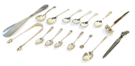 A mixture of silver and silver plate, comprising three alpha plate Fiddle pattern teaspoons, a pair of George V silver sugar tongs, an Eastern reeded topped teaspoon, white metal stamped 800, a silver and leather twist handled caddy spoon, four various si