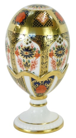 A Royal Crown Derby Old Imari pattern egg and cup, the egg with gold stopper, in base labelled LVI, 15cm high. (boxed)