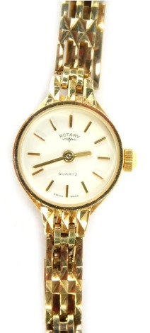 A Rotary 9ct gold lady's wristwatch, with a white coloured dial, and two bar bracelet, 10.7g all in, boxed.