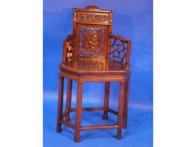 A 19thC Chinese chair of hexagonal frame and openwork form with a medallion