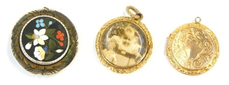 Three brooches and lockets, comprising a micro mosaic floral brooch, with a white metal border unmarked, 3cm wide, a yellow metal circular locket with shield crest and a memorial pendant 20.9g all in.