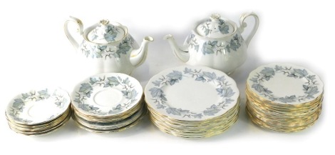 A Royal Albert part tea service in the Silver Maple pattern, comprising two teapots, saucers, side plates and dinner plates.