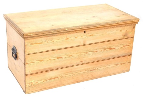 A Victorian pine blanket box, with three panelled front and wrought metal handles 49cm high, 99cm wide, 50cm deep.