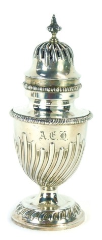 A Victorian silver sugar caster, of urnular form with wrythen body and circular foot, inscribed ACH, maker EH, London 1893, 7oz, 8cm high.