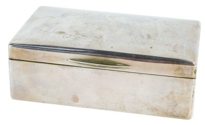 A George V silver cigarette box, with facsimile signatures, marked A J Hopkinson to centre, signatures including H Martin and others, yellow material lined interior, CS & Co Ltd, London 1928, 6cm high, 16cm wide, 9cm deep, 16¾oz gross.