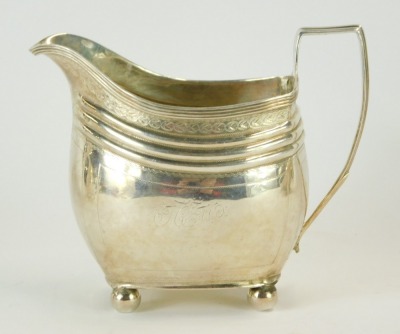 A Georgian silver three piece tea set, of reeded and bright cut decorated form and having gadrooned border under the lid, maker Peter & William Bateman, London 1806, teapot 17oz gross, sucrier 8oz, creamer 5oz. (3) - 5