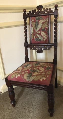 A Victorian mahogany child's chair, with barley twist supports and wool work seat, 85cm high.