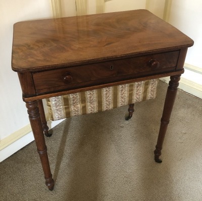 A Victorian mahogany work table, with flamed and moulded rectangular top, frieze drawer with knob handles, turned legs and brass castors, 71cm high, 62cm wide, 42cm deep. (AF) - 2