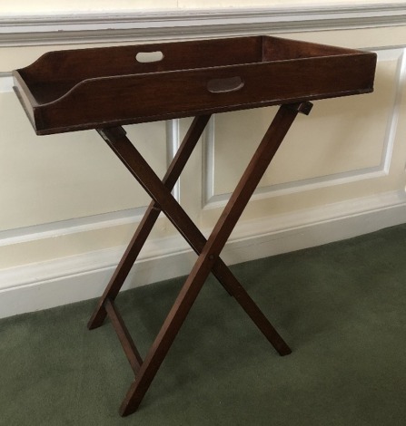 A 19thC mahogany butler's tray, with a folding stand, 96cm high, 80cm wide, 50cm deep. (2)