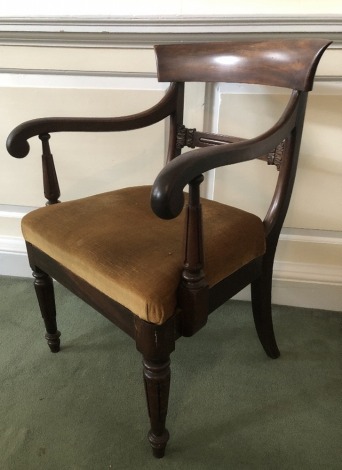 A William IV mahogany carver chair, with scroll arms, on turned legs.