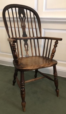 A 19thC high back ash and elm Windsor chair, with pierced vase splat, repair to hoop and H stretcher.