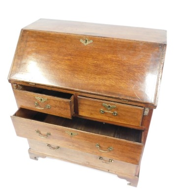 An early 19thC oak bureau, the fall above one short and two long drawers, on bracket feet, 98cm high, 86cm, wide, 48cm deep. (AF) - 3