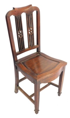 A Chinese hardwood chair, with pierced splat back with Buddhistic symbols, on shaped legs, 98cm high.