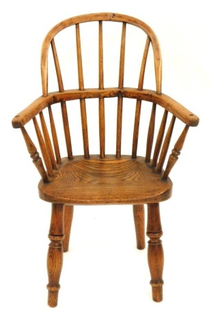 A 19thC ash and elm child's Windsor chair, with solid seat, 68cm high, 33cm wide, 25cm deep.