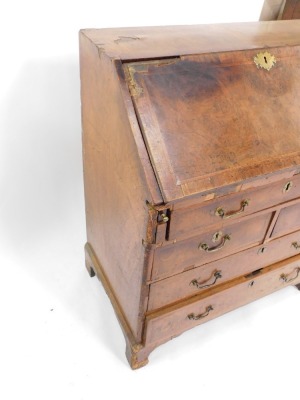 A George I walnut bureau, the fall opening to reveal a fitted interior, plate above arrangement of one long, two short and two long drawers on bracket feet, 106cm high, 91cm wide, 52cm deep. (AF) - 3