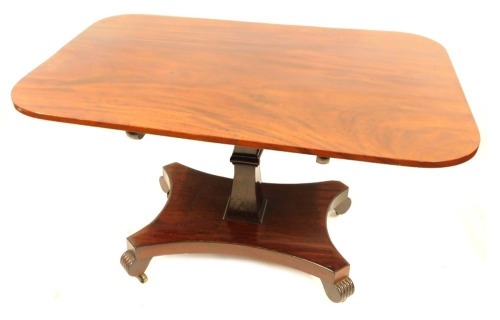 A William IV mahogany breakfast table, the rectangular top with moulded corners on a snap clasp, with claw feet terminating in castors, 85cm high, 130cm wide, 90cm deep.