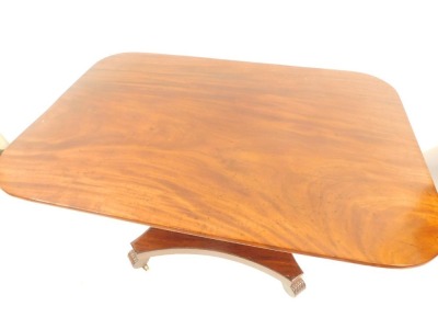 A William IV mahogany breakfast table, the rectangular top with moulded corners on a snap clasp, with claw feet terminating in castors, 85cm high, 130cm wide, 90cm deep. - 2