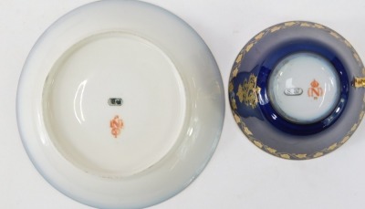 A 20thC Sevres style cup and saucer, on a cobalt blue glaze, with gilt vine detail and Napoleon crest, orange stamp to underside, stamped S57, the cup 5cm high, the saucer 14cm diameter. - 2