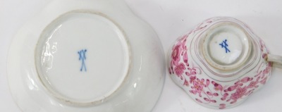 A pair of Meissen coffee cans and saucers, each with fluted and gilt rims, with pink painted flowers and blue cross marks to underside. (AF) - 2