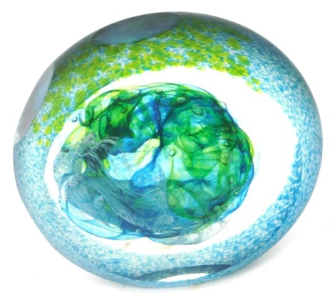 A Jane Charles art glass paperweight, with sliced green, blue and white detail and three stepped feet, signed, 14cm high.