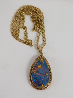 An opal doublet tear drop pendant, marked 14k, 4cm high, attached to a heavy link necklace, marked 375, 11.3g all in. - 2