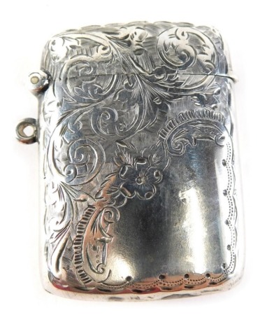 An Edward VII silver vesta case, with side ring handle, etched with scrolls and flowers with curved back, Birmingham 1906, 6cm high, 1oz.