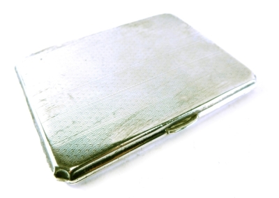 A George V silver cigarette case, by Walker and Hall, with canted corners and thumb mould opening, with engine turned decoration, Chester 1930, 5oz all in.