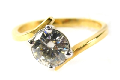 An 18ct gold single stone dress ring, set with imitation diamond, in four claw setting with twist design shoulders, ring size M½, 3.9g all in, boxed.