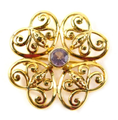 An amethyst brooch, with gilt finish and central amethyst, white metal stamped 925, 3cm wide, 7g.