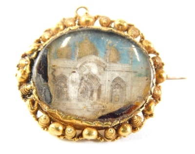 A Victorian memorial brooch, with St Paul's Cathedral painted panel, in a yellow metal border, unmarked, 2cm wide, 4.5g all in. (AF)