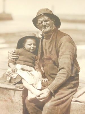 Francis (Frank) Meadow Sutcliffe (1853-1941). Fisherman and child, gelatin carbon print, 19cm x 15cm.