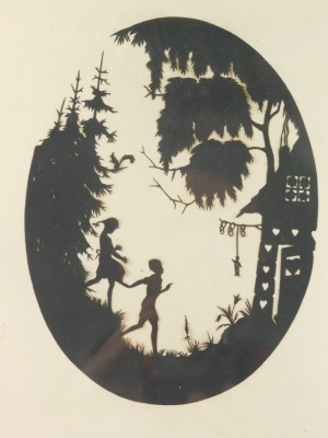 An early 20thC silhouette, of children on a bank before houses and trees, oval, unsigned, 20cm x 15cm.