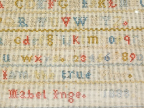 A Victorian alphabetic and numeric sampler by Mabel Inge, dated 1888, 20cm x 27cm.