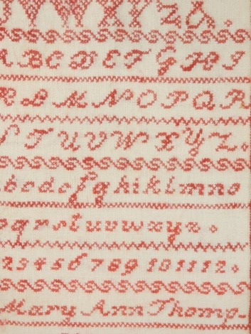 A Victorian alphabetic and numeric sampler by Mary Ann Thompson, 1863, 41cm x 22cm.