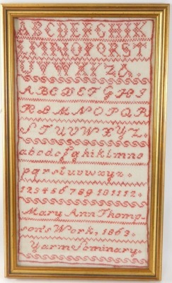 A Victorian alphabetic and numeric sampler by Mary Ann Thompson, 1863, 41cm x 22cm. - 2