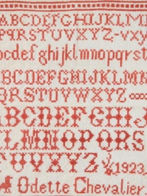 A George VI alphabetic sampler by Adette Chevalier, 1923, 27cm x 24cm.