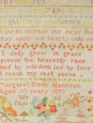 A Victorian pictorial alphabetic sampler by Margaret Emily Harrison, aged ten, 1893, 23cm x 42cm.