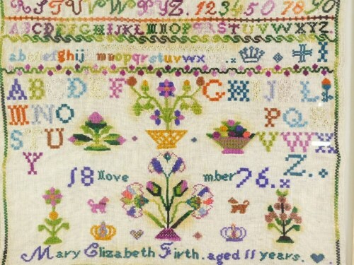 A Victorian pictorial alphabetic and motto sampler by Mary Elizabeth Firth, aged eleven years, Nov 1876, 39cm x 42cm.