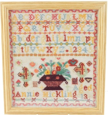 A pictorial alphabetic and numeric sampler Annie Hickling, aged thirteen, 26cm x 23cm. - 2