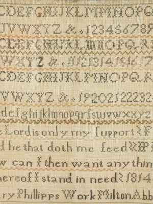 A George III alphabetic, numeric and motto sampler by Mary Phillips, Milton Abbot 1814, 34cm x 31cm.