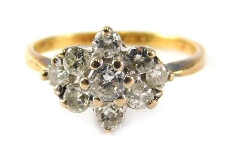 A 18ct gold diamond cluster ring, the central cluster with seven stones and two diamond outer points, each stone approximately 0.05 carats, in claw setting, ring size K, 2.7g.