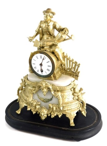 A Victorian and later gilt metal and marble mantel clock, the 8cm diameter enamel Roman numeric dial, surmounted by figure of a gardener aside fence, the base raised with scrolls satyr mask heads and flowers on an ebonised stand, with striking on the hour