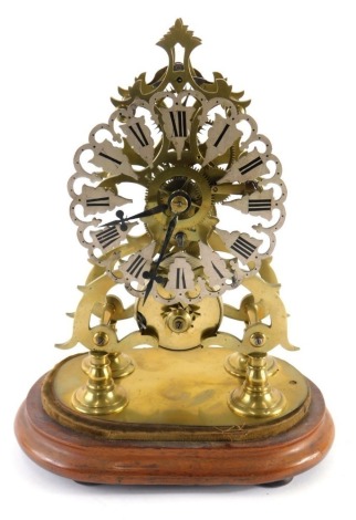 A brass skeleton clock, with 14cm wide flower head Roman numeric dial, fronting a single fusee movement, on quadruple turned supports and wooden base, with part glazed dome, with key and pendulum. (the dome AF)