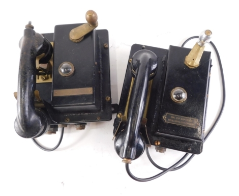 Two similar of brass and black painted ship's telephones, each with various apertures for wires, brass cradle, a lens for a light, etc., one with clear label marked MK.XV A.P13231 TELE.MFG.Co London, the other indistinct but marked A.T and E.C Limited, Li