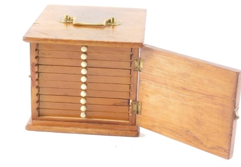 A set of late 19th/early 20thC microscope slides, contained in a stained pine cabinet with various drawers, the cabinet 19cm wide.