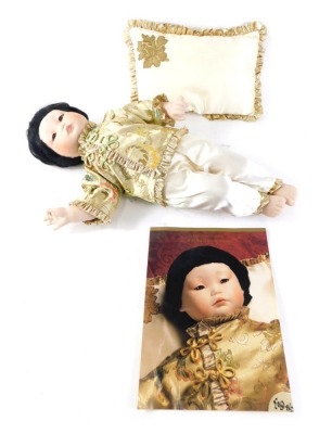 A Franklin heirloom doll, The Imperial Chinese Baby Doll, with accessories and paperwork, 46cm high.