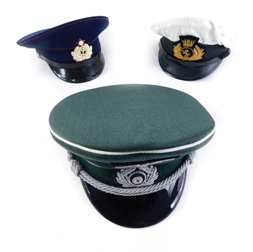 Three various reproduction military peak caps, one with Russian badge, size 57, etc. (3)